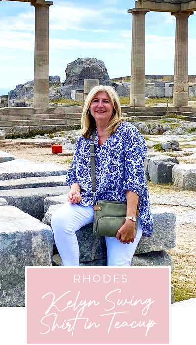 Loyal customer of Australian and New Zealand women's clothing label, L&F, Susan wears a blue and white patterned, lightweight, Australian-made shirt in Greece, as part of her guide for over-40s women on what clothes to pack for your travel holiday.
