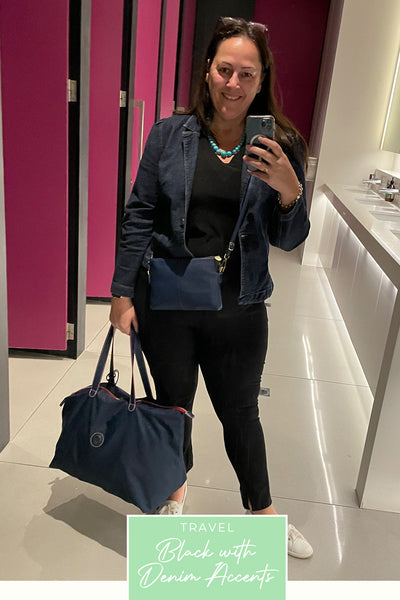 Showing what to wear for a long haul flight, a plus size, curvy woman wears slim leg black pants with stretch, a black V-neck top and ethical denim jacket, all made in Australia by women's fashion brand, Leina & Fleur. 