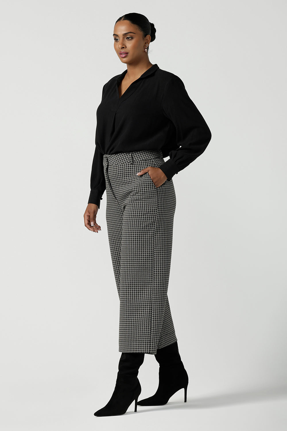 A size 10 woman wears the Yael Pant in Jacquard. Styled back with the Ellis Shirt in Black Tencel. A textured jacquard knit suit set. Made in Australia for women size 8-24