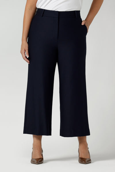 Close up of Yael Pant in Navy Ponte. Tailored high waist pants with pockets and front zip. Cropped culotte length and styled back with white bamboo top. Made in Australia for women size 8 - 24.