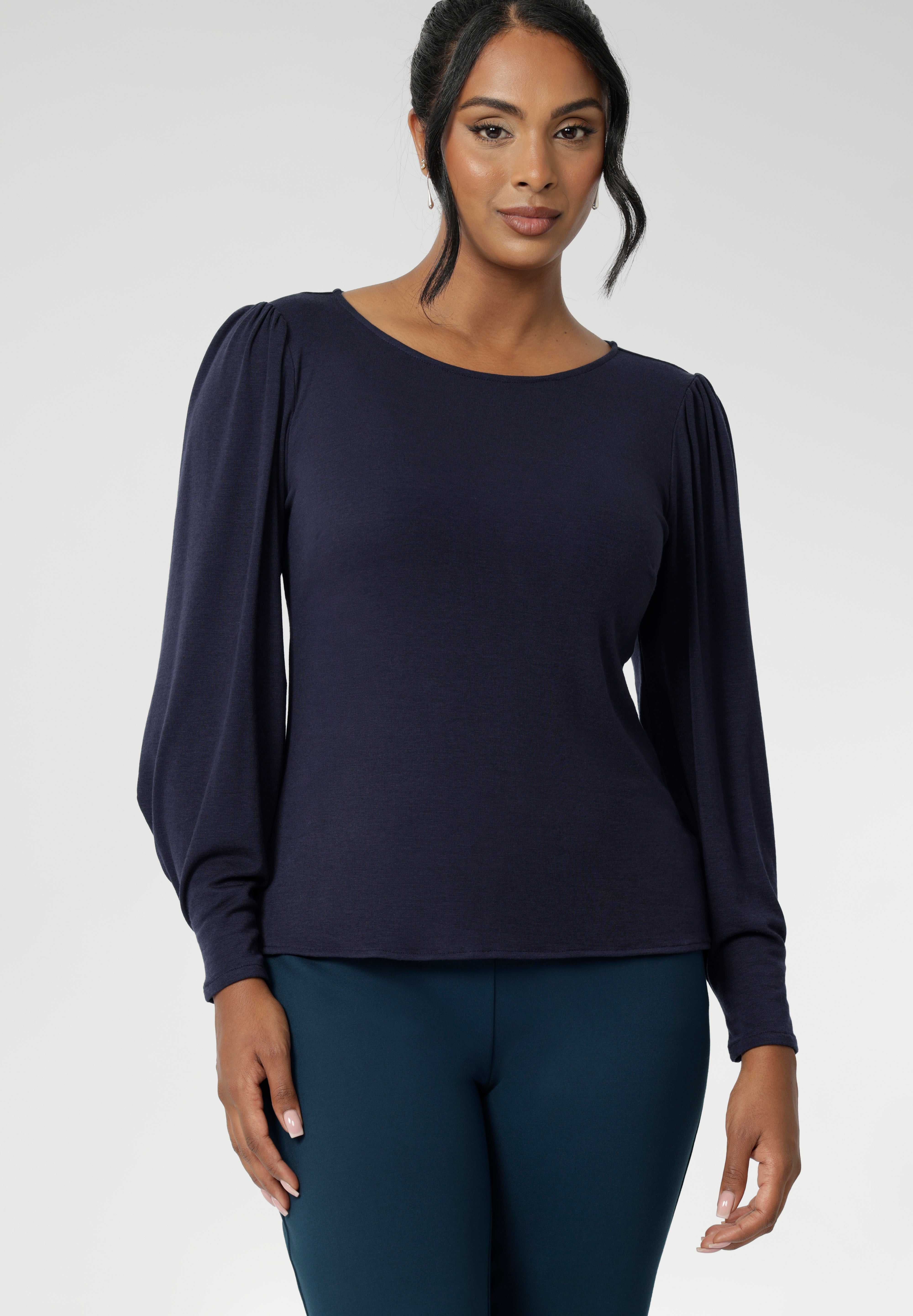 The Zara Top in Navy creates subtle shaping through the body and bust darts create a flattering, close-to-body fit that moves easily from work to weekend. The hemline is thoughtfully finished with a straight front and a slightly longer curved back for extra coverage and a polished touch. 