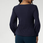 Feminine cut knit top features a boat neckline and full-length bellow sleeves with soft gathers at the shoulders and tailored darts at the wrists, adding gentle volume without the bulk. Subtle shaping through the body and bust darts create a flattering, close-to-body fit that moves easily from work to weekend. Available in sizes 8-24.