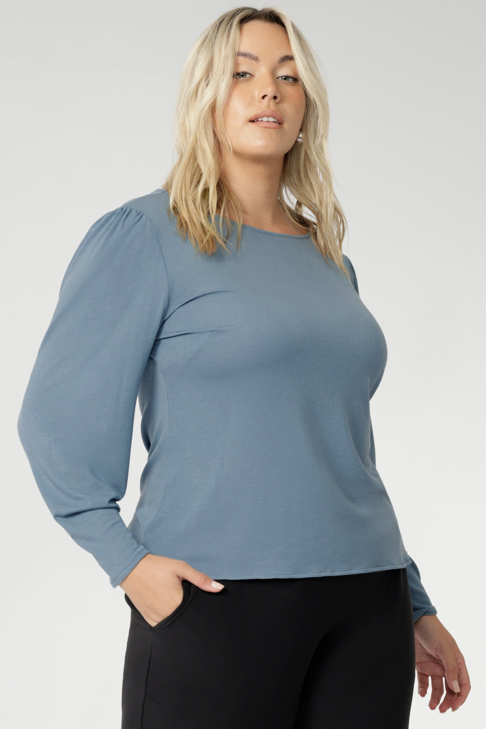 The Zara knit top, a refined yet relaxed essential designed for cool-weather layering. With its modern silhouette and graceful bellow sleeves, this piece delivers understated elegance and all-day comfort. The boat neckline frames the collarbone with subtle sophistication, while tailored bust darts and a close-to-body shape enhance the fit without feeling restrictive.