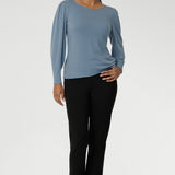 A straight hemline at the front keeps the look streamlined, while the longer, curved hem at the back offers extra coverage and an elevated finish. Looks wonderful tucked or untucked into pants or skirts. Size 10 women wears Zara Knit Top in Sky with exact Black Paxton Pant.