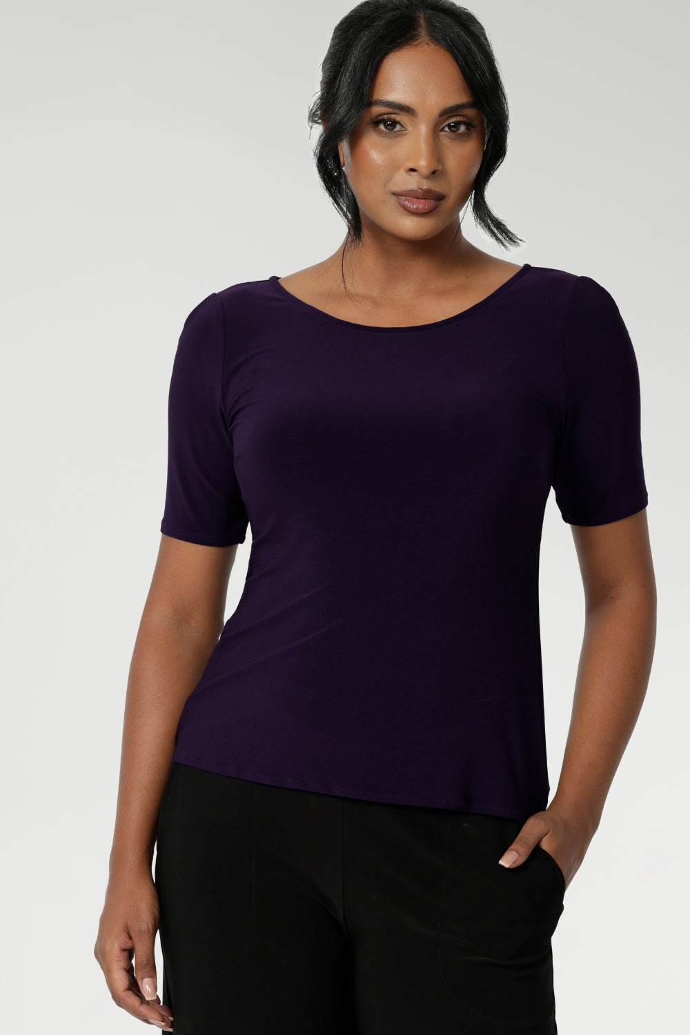 A size 10 woman wears the Ziggy Amethyst Top with boat neckline made in comfortable easy care jersey. Comfortable workwear for women. Clothing for petite to plus size women 8-24. 