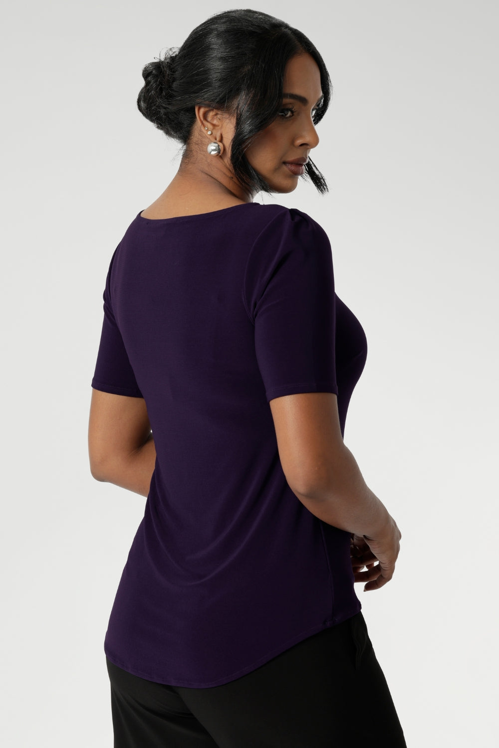 Workwear top with boat neckline made in comfortable easy care jersey, features above elbow sleeves and shirttail hemline. Comfortable workwear for women. Shop petite and plus sizes 8-24. 