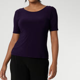 A size 10 woman wears the Ziggy Amethyst Top with boat neckline made in comfortable easy care jersey. Comfortable workwear for women. Clothing for petite to plus size women 8-24. 