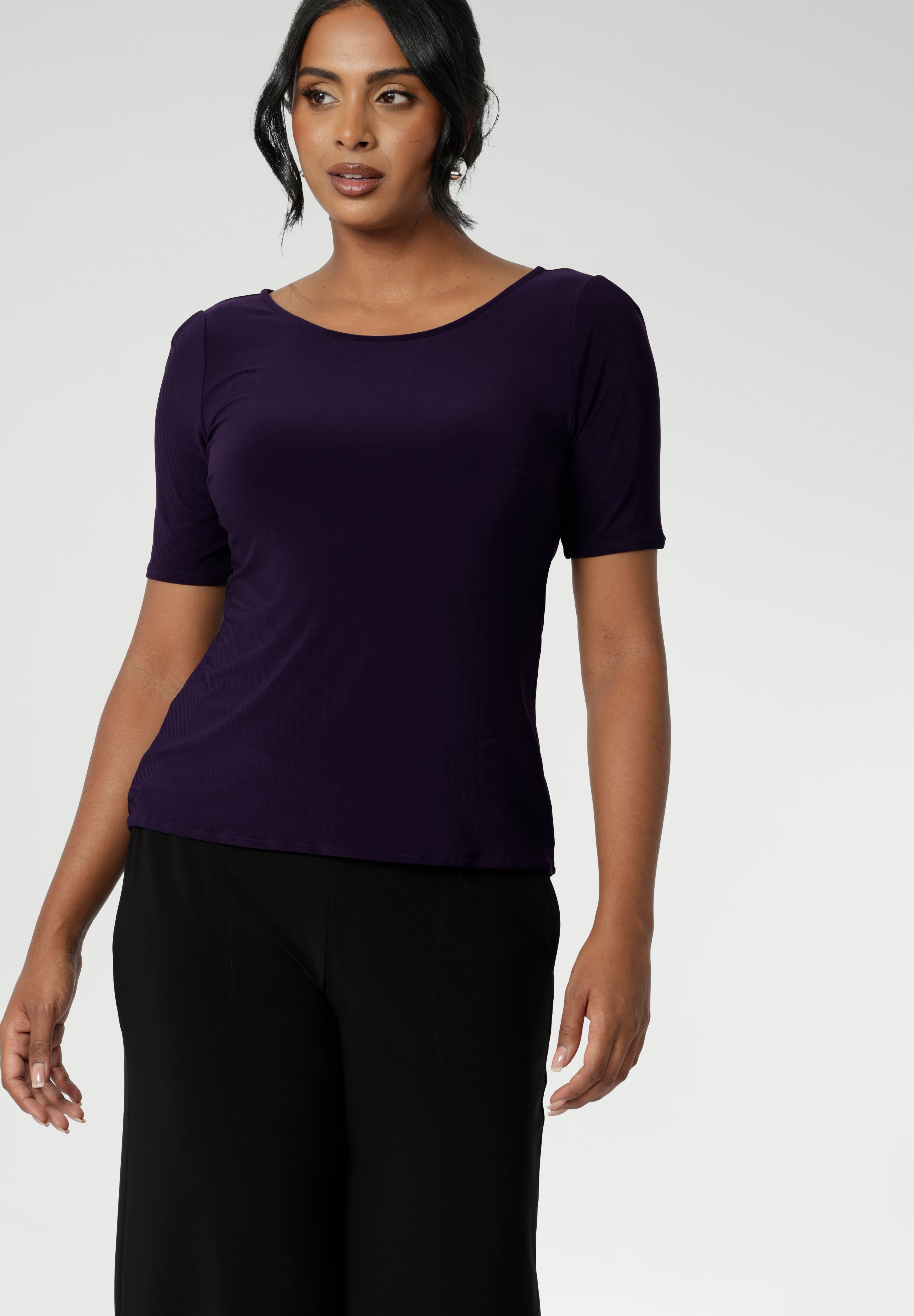 A size 10 woman wears the Ziggy Amethyst Top with boat neckline made in comfortable easy care jersey. Comfortable workwear for women. Clothing for petite to plus size women 8-24. 