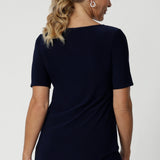 Back view image of navy top featuring elbow sleeves, straight neckline and straight hem. Can be easily paired with printed pants and heels for an elevated look or with sneakers for a casual look. Available in size 8-24.