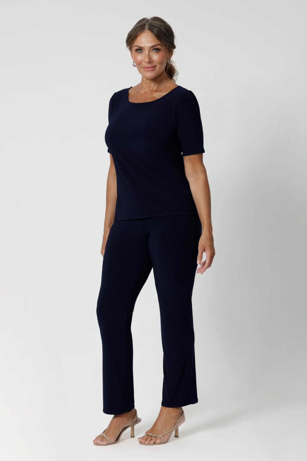 Back view image of navy top featuring elbow sleeves, straight neckline and straight hem. Available in size 8-24.