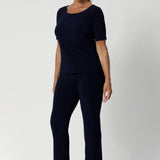 Back view image of navy top featuring elbow sleeves, straight neckline and straight hem. Available in size 8-24.