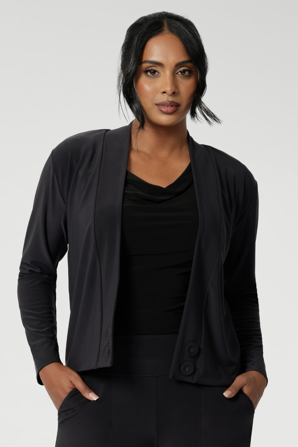 The Sandro Jacardi is a stylish and versatile jacket-like cardigan, designed to layer seamlessly over dresses and elevate any workwear wardrobe. Part of our Fluid Suiting collection, this cardigan offers a sophisticated look with a modern twist. The Sandro Jacardi in Charcoal is crafted from a heavy-weight dry-touch jersey base that provides a soft stretch, ensuring comfort and flexibility throughout the day.