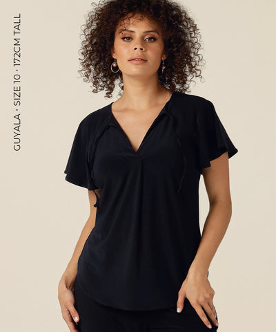 The Bowie Top is a Tie Neck Top in stretch Jersey with Flutter Sleeves and a Shirttail Hem. Designed and made in Australia by fit experts L&F for plus size, petite size women and women focused on eco-conscious, ethical and slow fashion