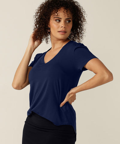 tailored short sleeve top with v-neckline and shirttail hemline
