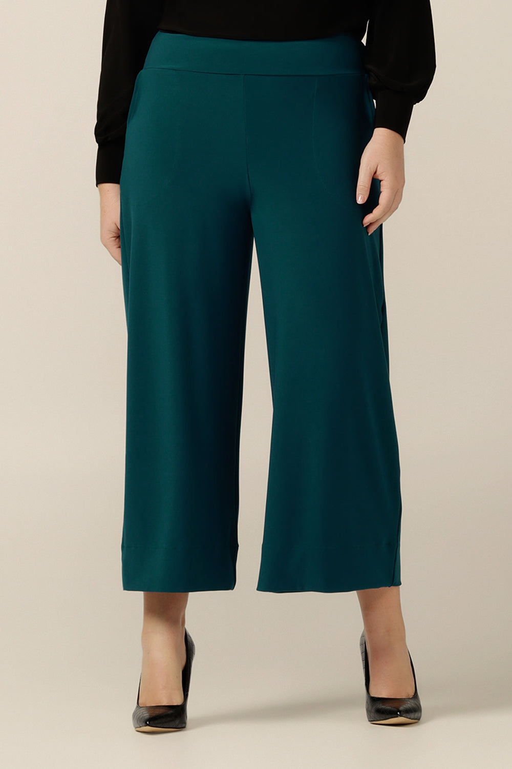 A close up of an Australian-made wide leg, cropped length jersey trouser in petrol green. By Australian and New Zealand fashion brand, L&F these work culotte pants promise to be a comfortable corporate trouser for sizes 8 to size 24. 
