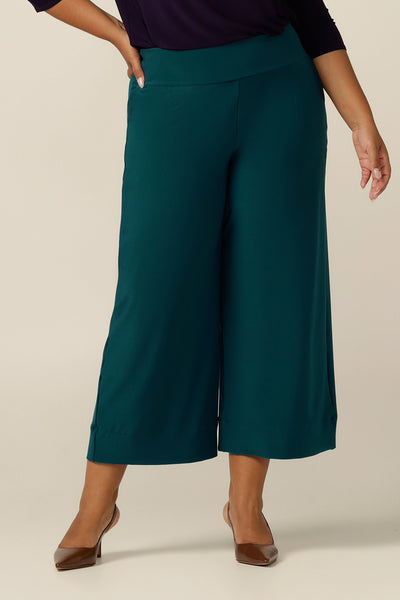 Made in Australia, the featured pants are Petrol green wide-leg culotte's. A pull-on pant style, these cropped-length women's trousers made in stretch jersey for comfortable work wear and are available in sizes 8 to 24. 
