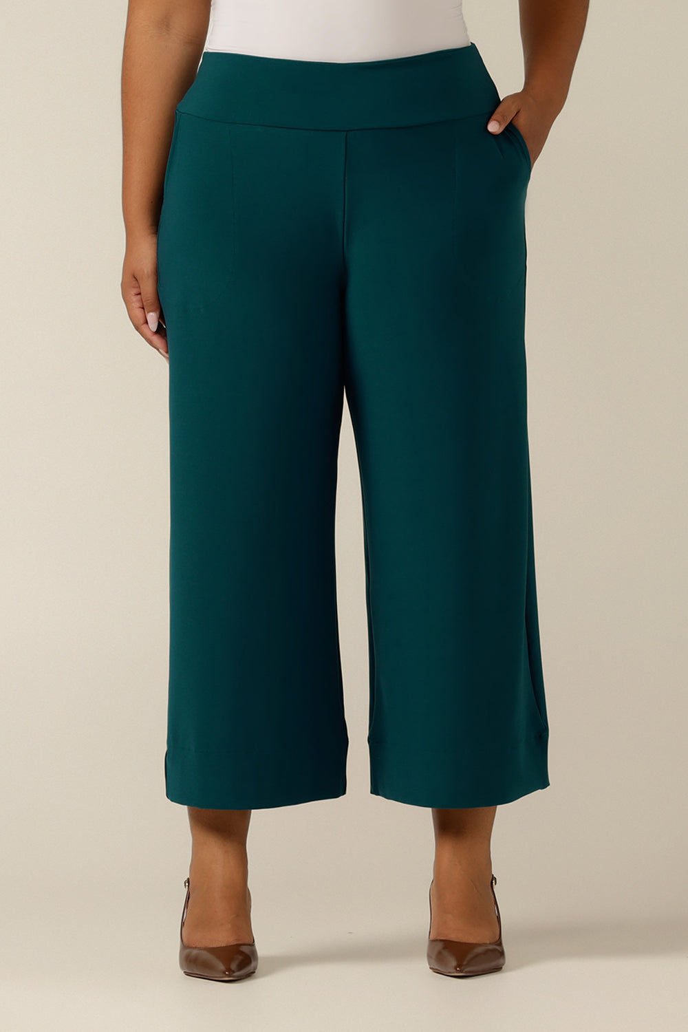 Made in Australia, the featured pants are Petrol green wide-leg culotte's for women in a size 18. A pull-on pant style, these cropped-length women's trousers made in stretch jersey for comfortable work wear and are available in sizes 8 to 24. 