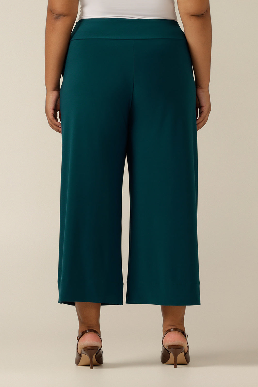 A close up of an Australian-made wide leg, cropped length jersey trouser in petrol green in size 18. Made by Australian and New Zealand women's clothing label, L&F these quality culotte work pants promise to be a comfortable corporatewear trouser for sizes 8 to size 24. 