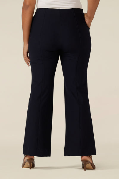 close up back view of flared leg pants, size 12, in navy ponte jersey. Made by Australia and New Zealand women's clothing label, L&F, these Australian-made, mid-rise navy trousers make comfortable workwear as well as casual pants.
