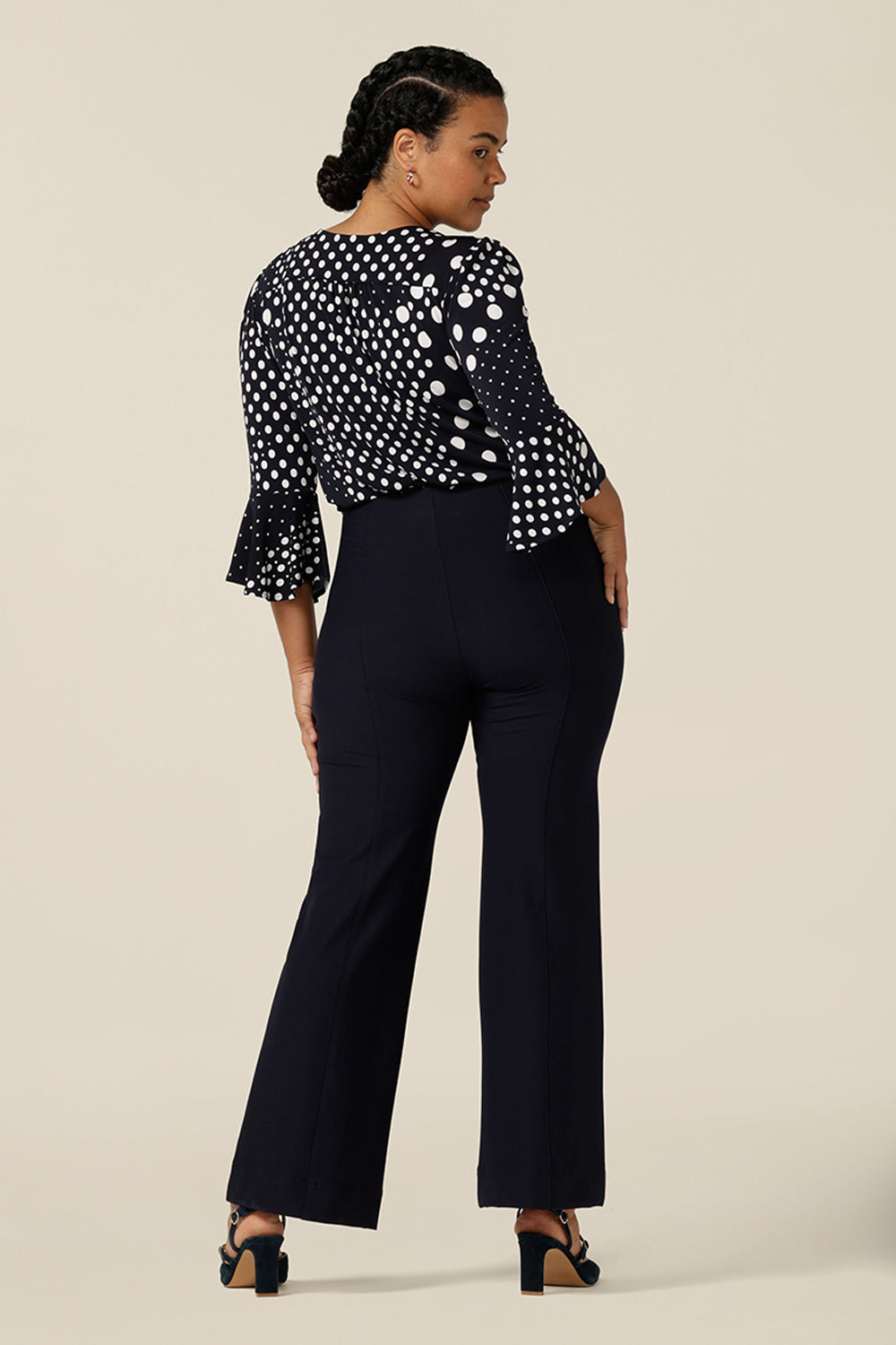 Good for workwear or evening wear pants, these navy trouser by Australia and New Zealand women's fashion label, L&F feature full-length, boot-cut flared legs. Worn with a navy and white print top for elegant corporate style. 