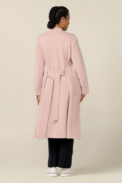 The top reason to love soft tailoring for winter, this luxurious coat style comes in dusty pink, stretch modal fabric for comfortable layering. Fitting easily over workwear and suiting, wear this lightweight coat for work travel and the corporate commute.