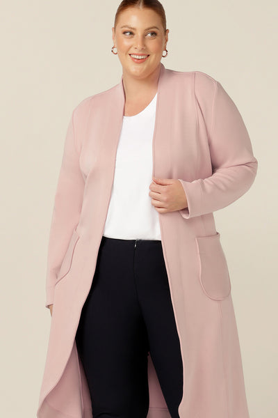 An easy and comfortable light-weight coat for travel wear, this dusty pink modal trench coat is one to add to your travel wardrobe - transition city climates with ease for weekend getaways and work travel away days..