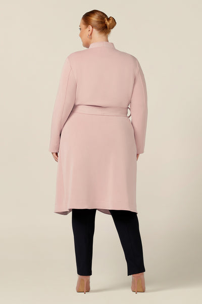Back view of a light-weight winter coat by Australia and New Zealand women's clothing brand, L&F. In dusty pink, modal jersey, this soft tailoring coat style is comfortable layered over workwear pants and corporate suiting.  