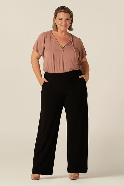 Women's size inclusive work pants. Pictured on a size 8 in black comfortable corporate pants. Full length straight leg pants