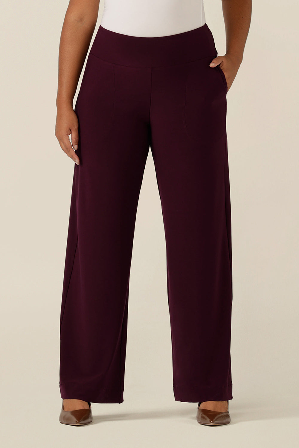 A close up of an Australian-made wide leg, full length Mulberry red jersey pant in size 12. By Australian and New Zealand women's clothes brand, L&F these wide leg work pants promise to be a comfortable office trouser for sizes 8 to size 24. 