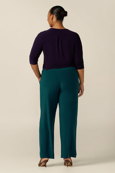 Back view of made-in-Australia women's work pants in Petrol green jersey. A pull-on pant style, these full-length wide leg trousers are made in stretch jersey for comfortable work wear and are available in sizes 8 to 24. 