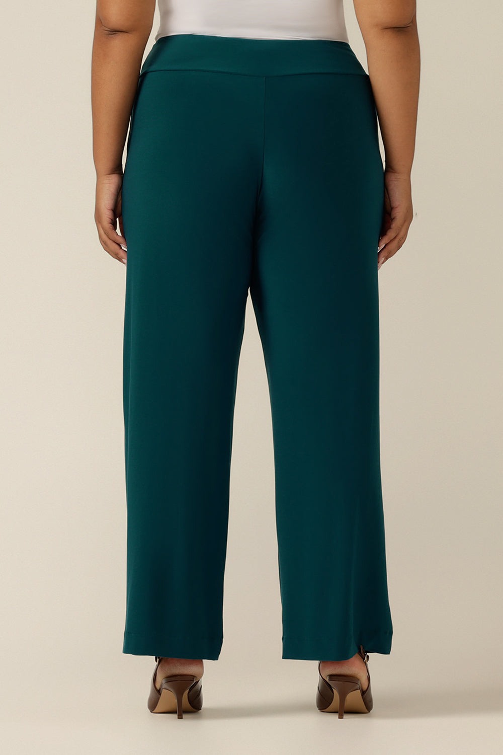  A close up of an Australian-made wide leg, full length jersey trouser in petrol green. By  Australian and New Zealand fashion brand, L&F these straight leg, corporate pants promise to be a comfortable workwear trouser for sizes 8 to size 24. 