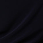 navy blue jersey fabric used by Australian and New Zeland women's clothing brand, Leina & Fleur to make an elegant evening dress with fluted sleeves.