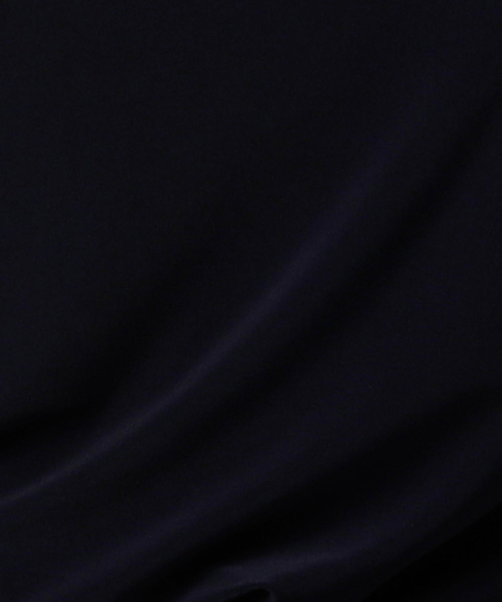 navy blue jersey fabric used by Australian and New Zeland women's clothing brand, Leina & Fleur to make an elegant evening dress with fluted sleeves.