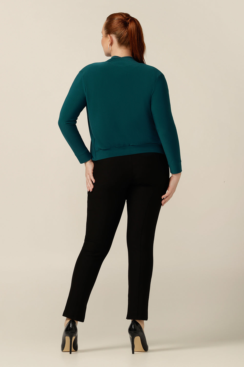 Back view of an Australian-made long sleeve, cardigan-style jacket in size 12. Good for trans-seasonal casual, work and corporate wear, this soft jersey jacket is comfortable for all-day office wear.  